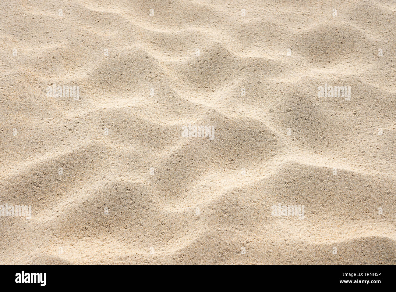 Beach sand texture. Summer background with a fragment of the seaside resort beach. Abstraction in nature Stock Photo
