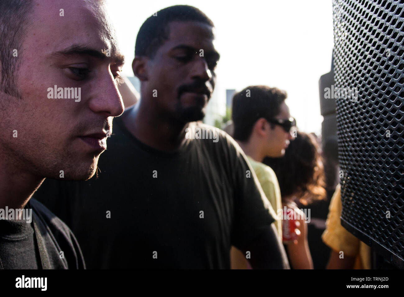 Partygoers dancing in front of speakers at Anti-Sonar free illegal squat party rave outside Sonar Festival, Barcelona, Spain Stock Photo