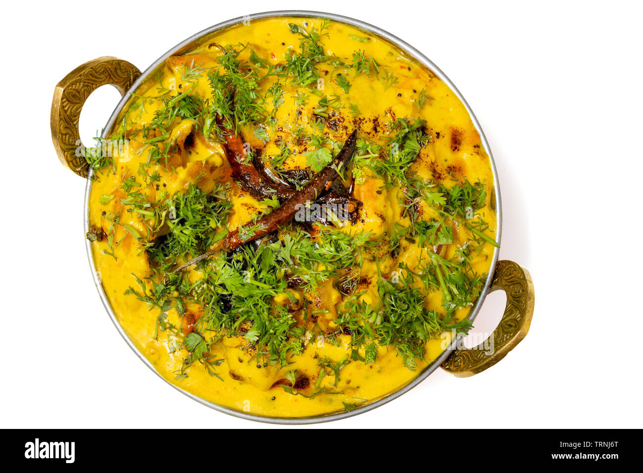 https://c8.alamy.com/comp/TRNJ6T/kadhi-pakoda-or-pakora-indian-cuisine-served-in-a-brass-kadai-or-bowl-isolated-on-white-background-TRNJ6T.jpg