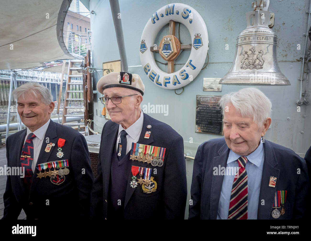 London, UK. 6th June 2019. Imperial War Museum marks 75th anniversary of the D-Day landing on board HMS Belfast. D-Day veterans from Blind Veterans UK board the HMS Belfast, the ship that led the Allied fleet on D-Day. L-R Arthur Barnes, John Connelly and Nev Lees. Credit: Guy Corbishley/Alamy Live News Stock Photo