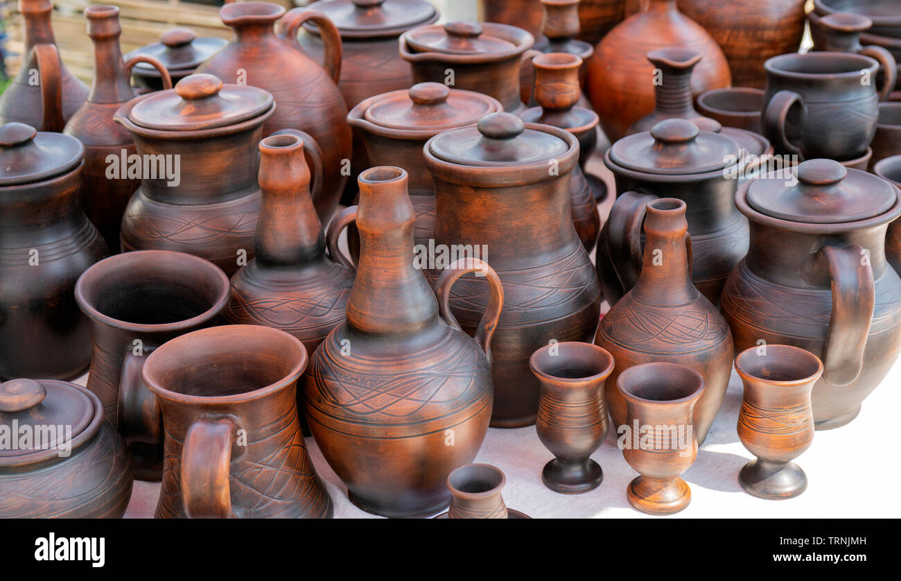 Handmade ceramic clay products. Jugs and glasses. Stock Photo