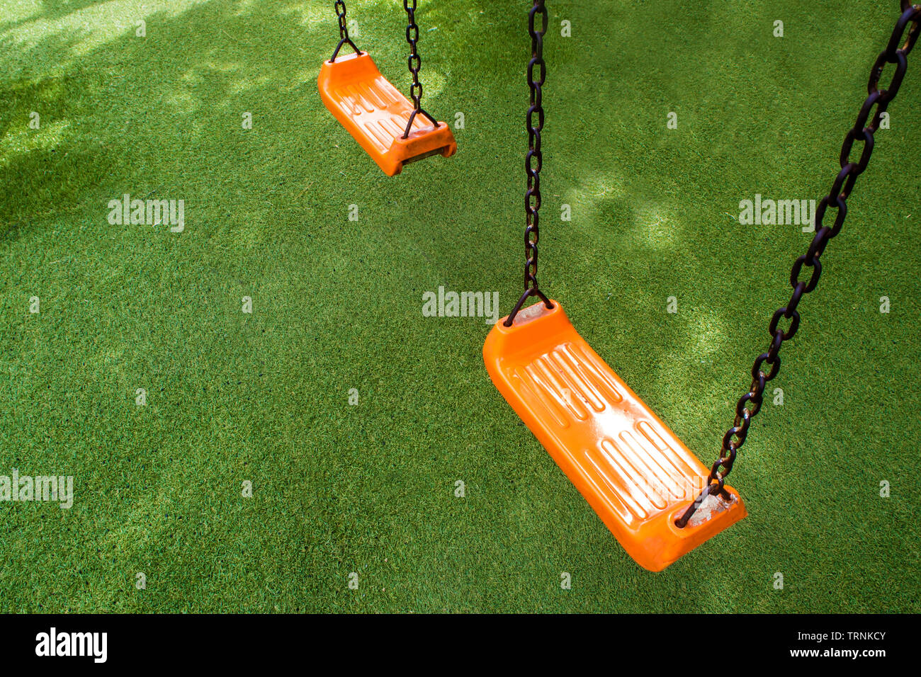 Swing seat on the artificial grass Stock Photo Alamy