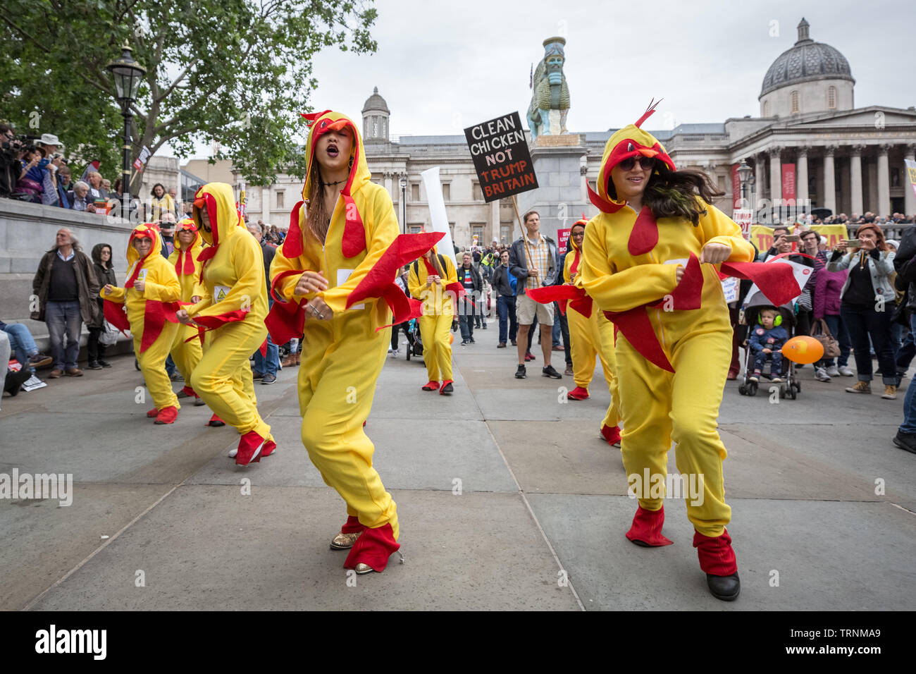 Chlorinated Chicken dancers perform in Trafalgar Square as part of the protests against US president Donald Trump's UK state visit. Stock Photo