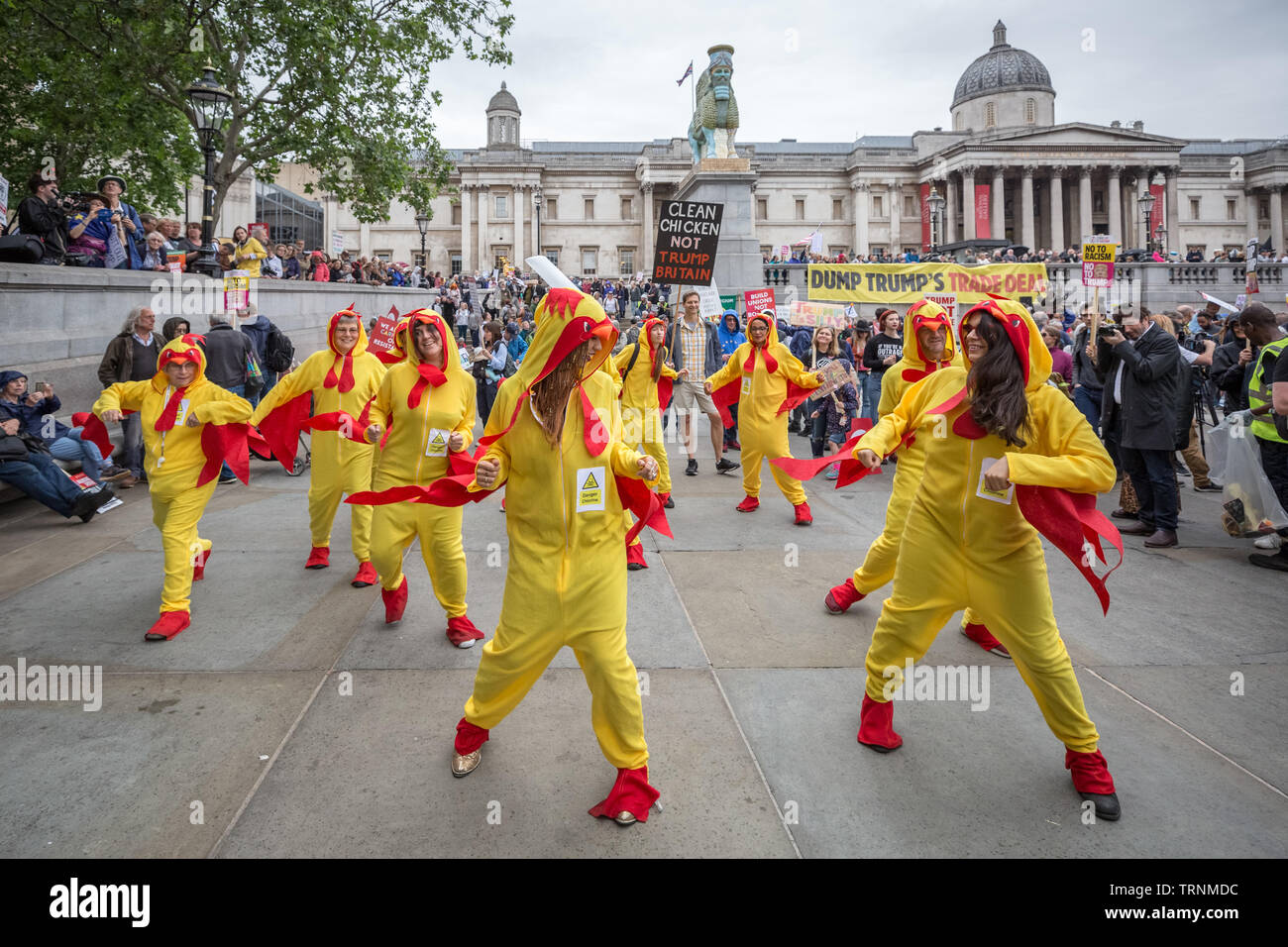Chlorinated Chicken dancers perform in Trafalgar Square as part of the protests against US president Donald Trump's UK state visit. Stock Photo