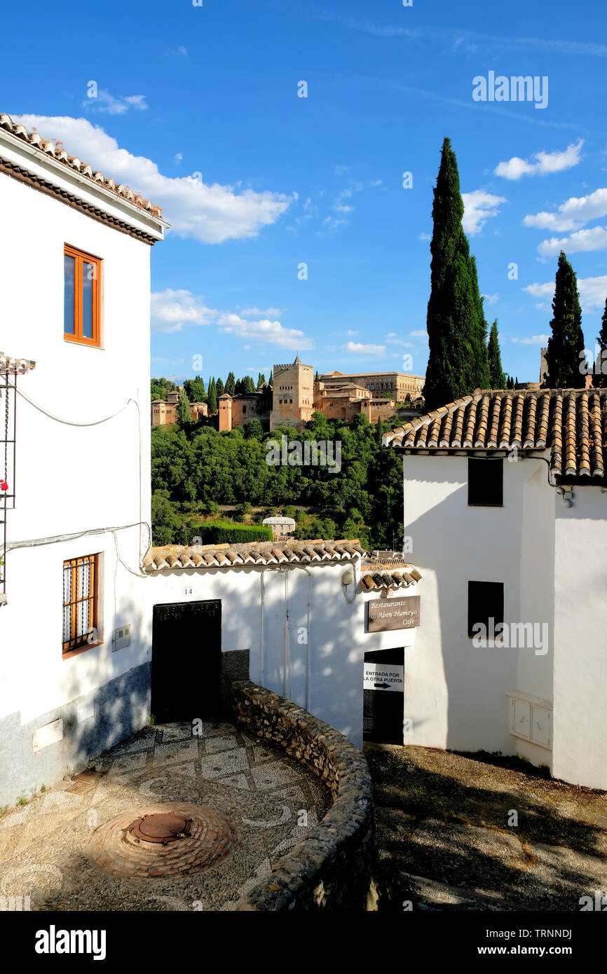 View of the Alhambra on a sunny afternoon from the Albaicin neighborhood in Granada, Spain; view from near the Restaurante Carmen de Aben Humeya. Stock Photo