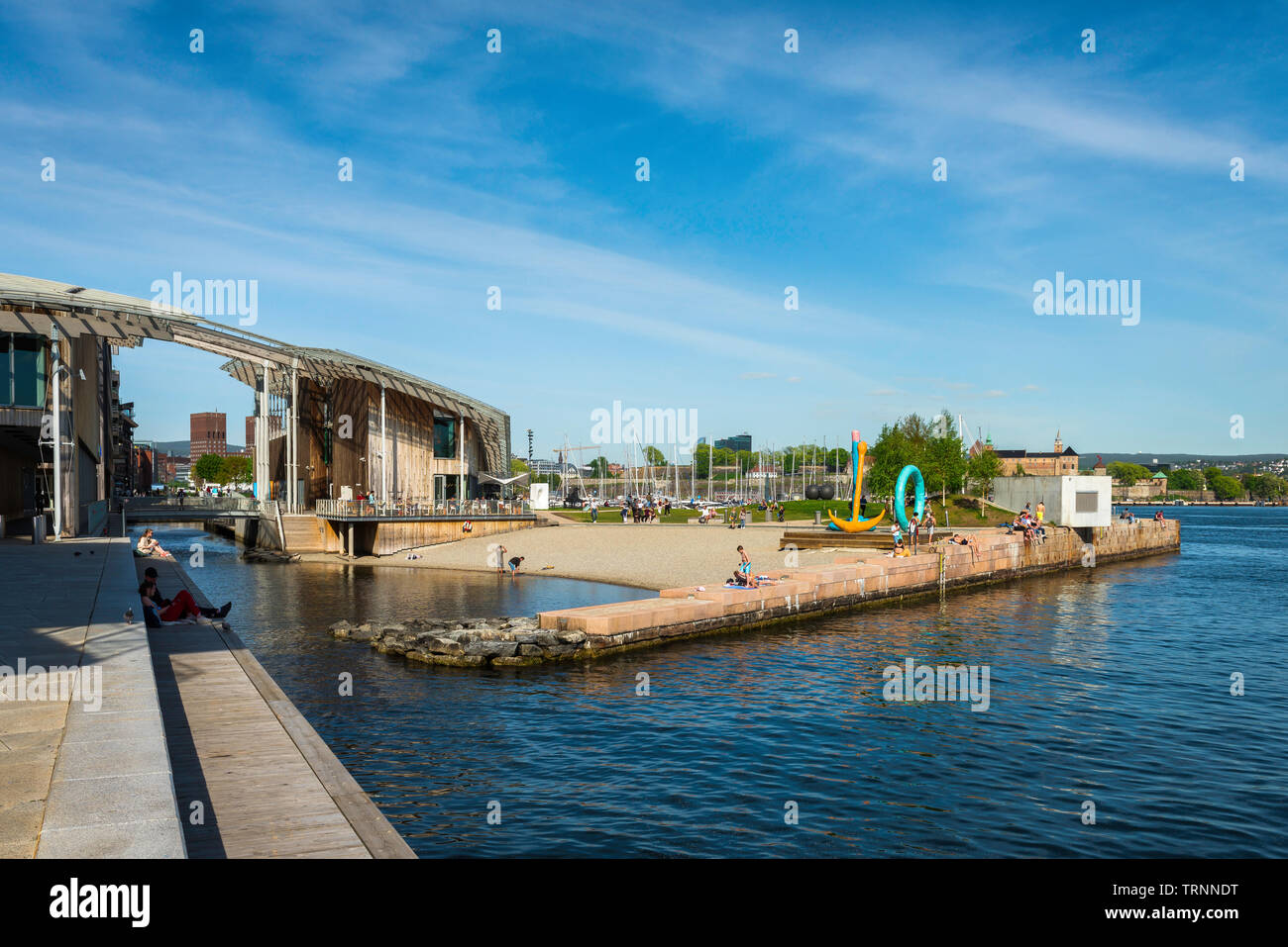 Oslo beach, view of people relaxing on Tjuvholmen City Beach in the harbour area of Oslo, Norway. Stock Photo