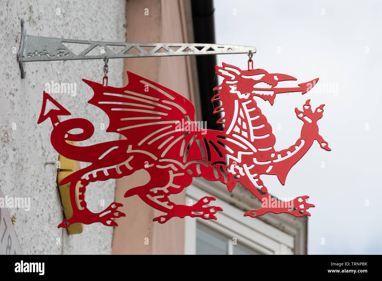 Welsh red dragon sign outside a shop in Saundersfoot, Wales, UK Stock Photo