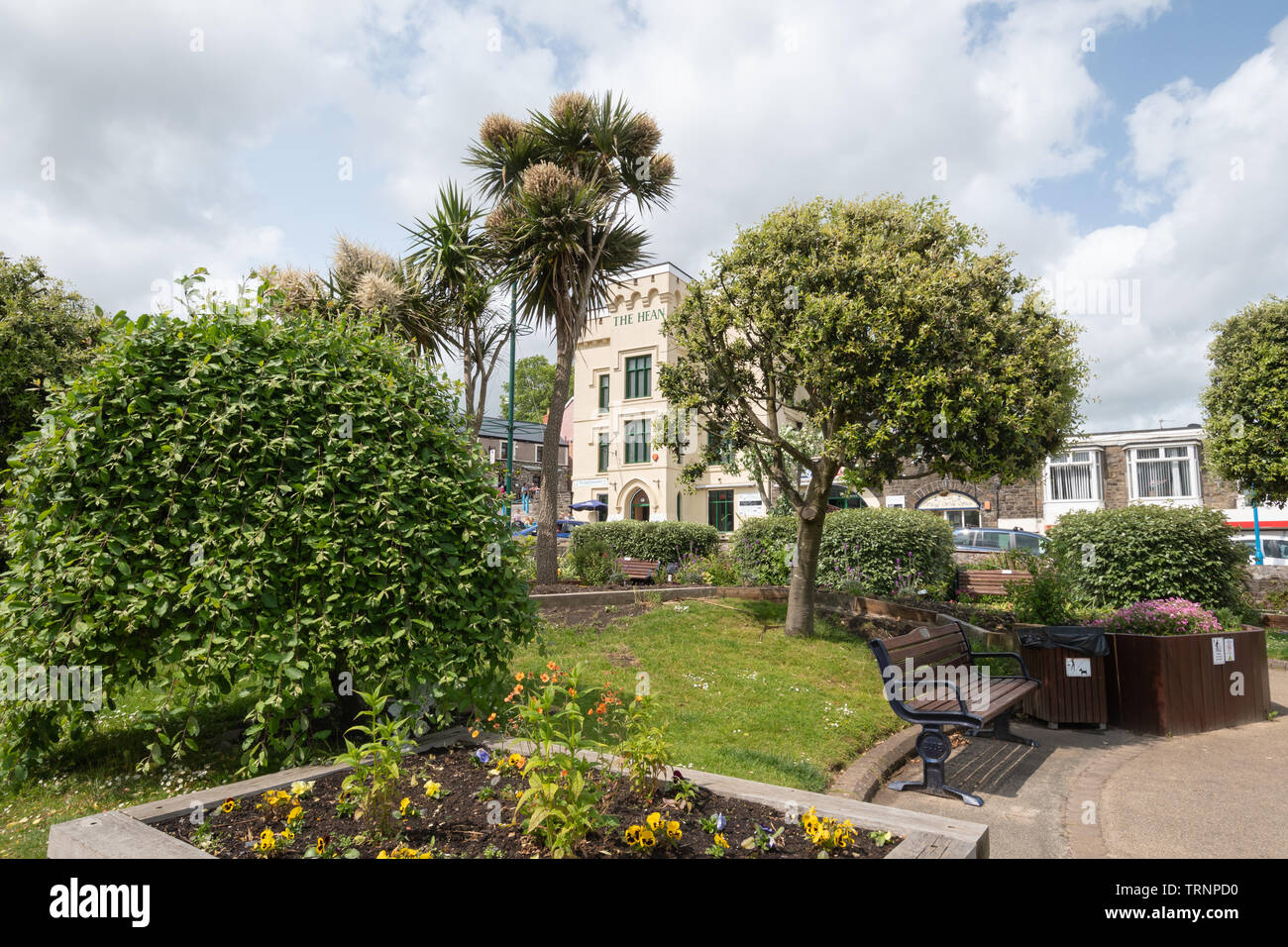 The sensory garden in Saundersfoot, Pembrokeshire, Wales, during summer with the Hean Castle pub in the background Stock Photo