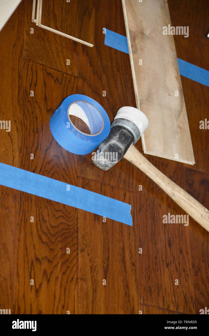 Installation of new engineered wood flooring Stock Photo - Alamy