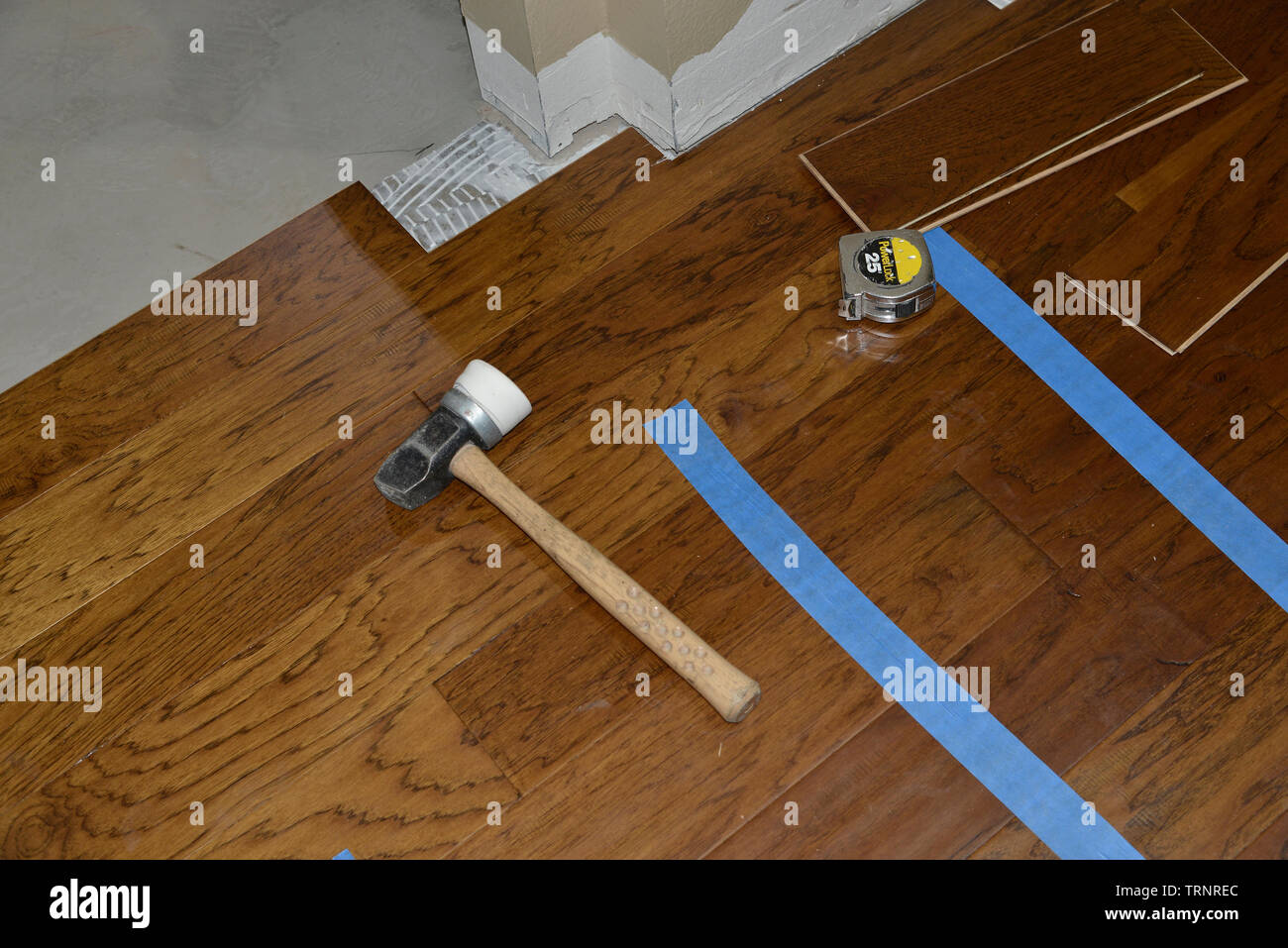 Installation Of New Engineered Wood Flooring Stock Photo