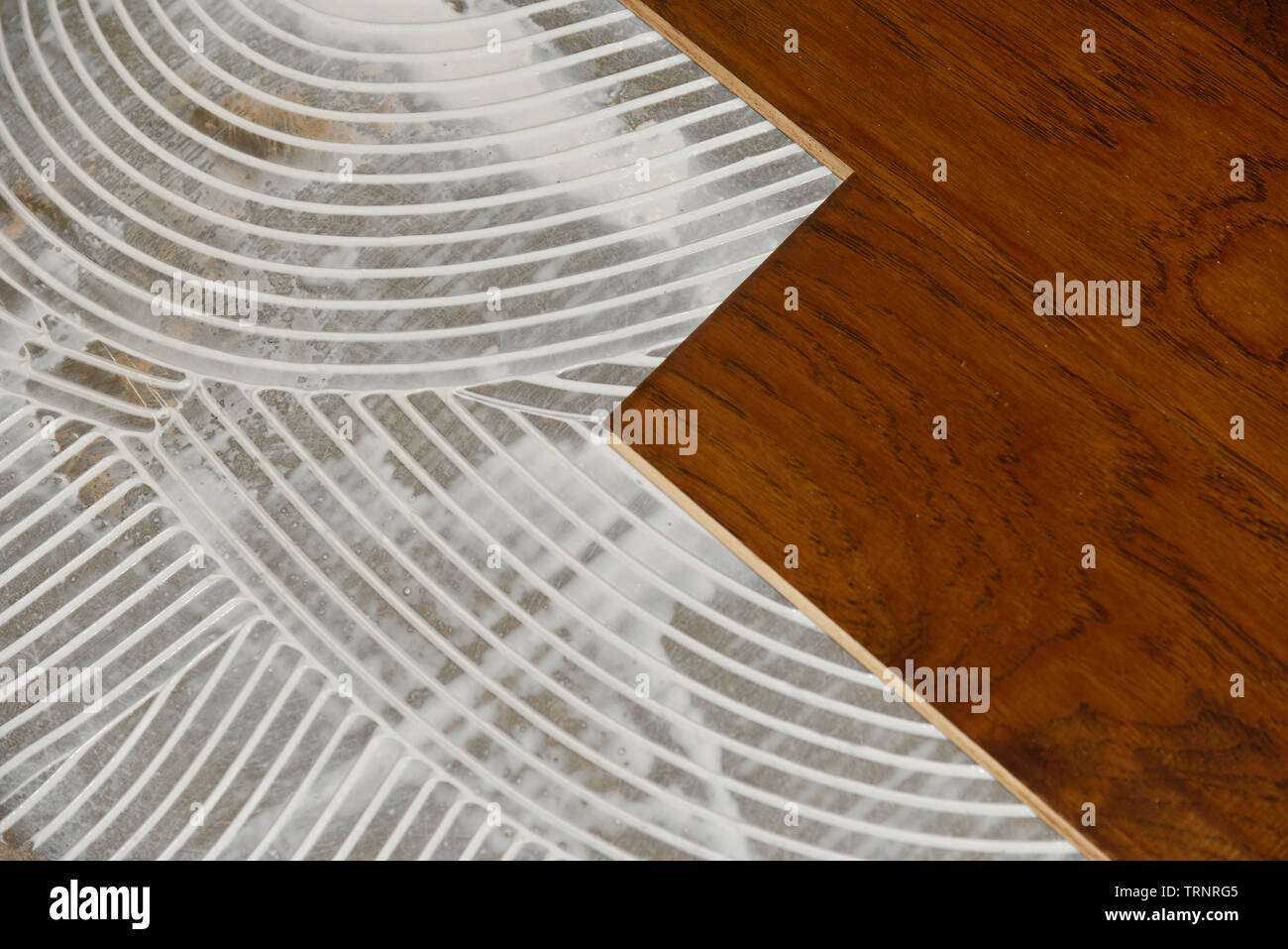 Installation Of New Engineered Wood Flooring Stock Photo