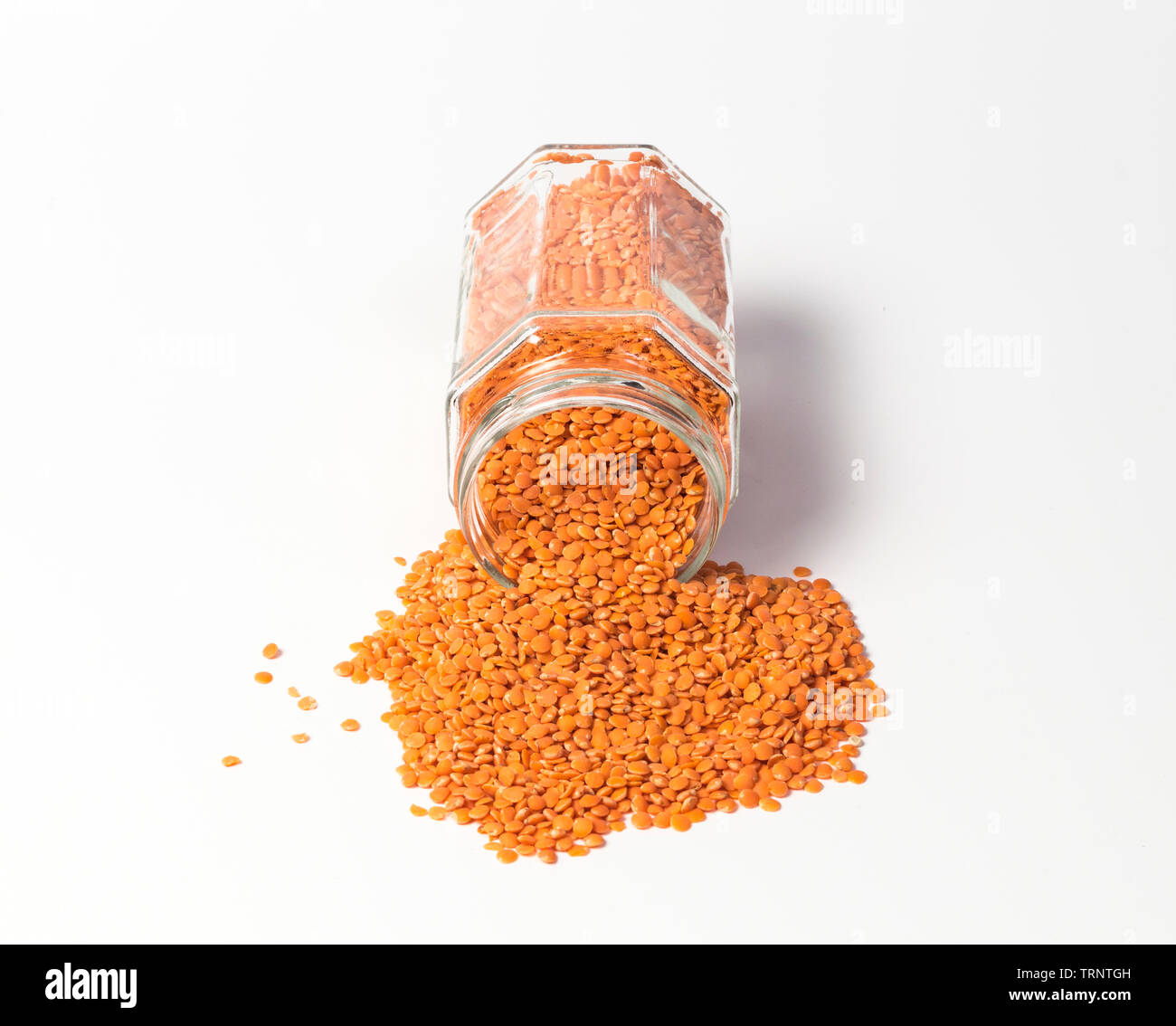 Red lentils in glass jar Stock Photo
