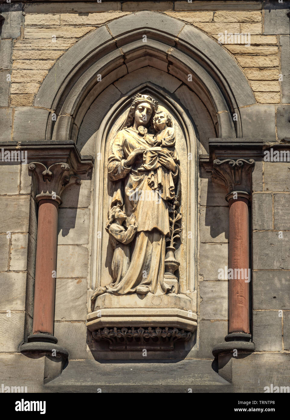 A statue of the Madonna and child set in an alcove of St Wilfrid’s 19th