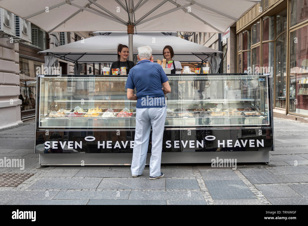 Belgrade, Serbia, June 6th 2019: Man buying from an ice cream stand at Knez Mihailova Street Stock Photo