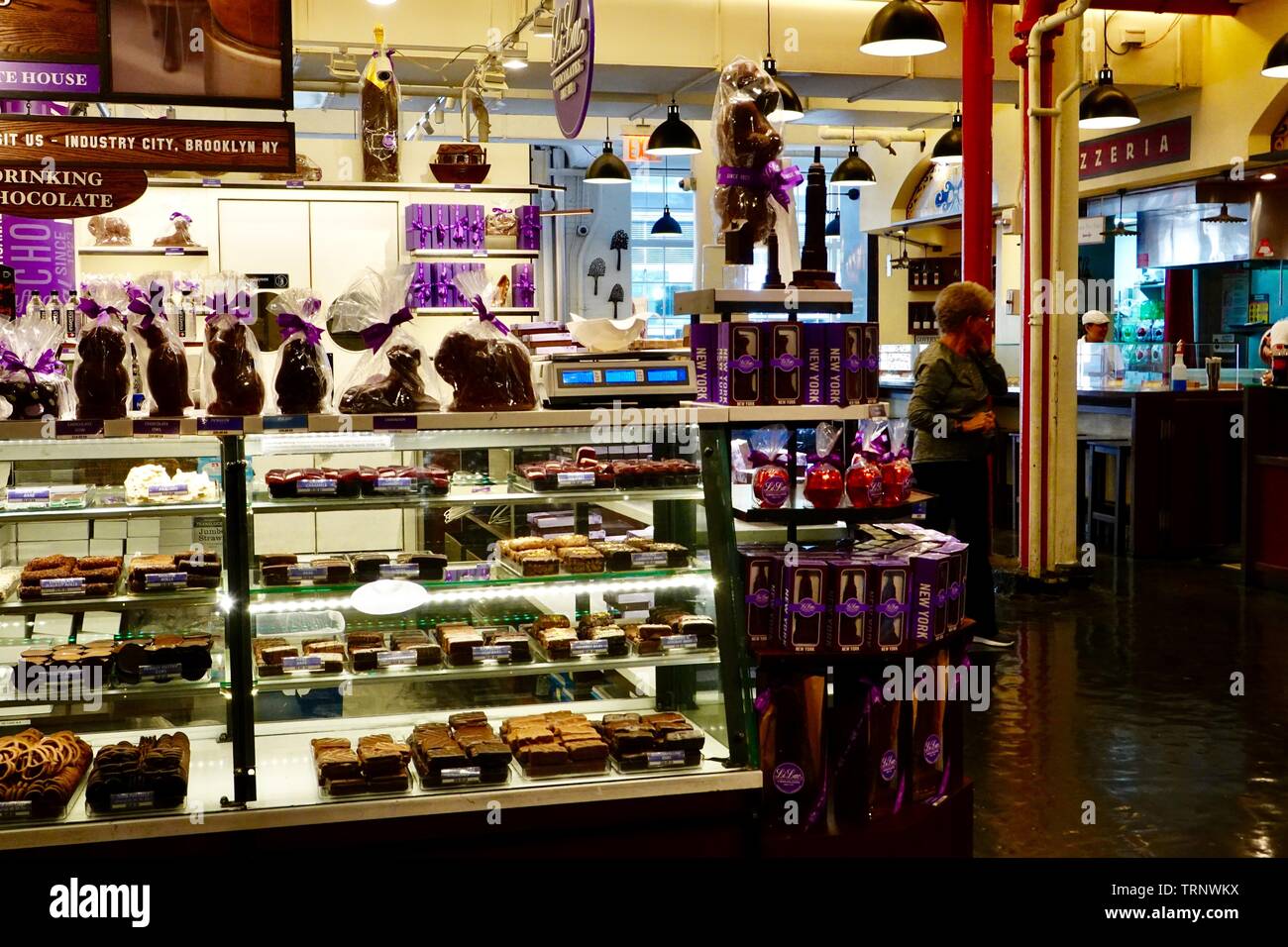 LiLac Chocolates, chocolate shop inside Chelsea Market with people New