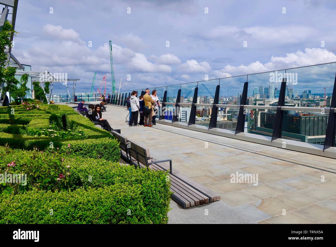 London, UK 7th June 2019 Visitors to the rooftop garden at 120 Fenchurch Street look out