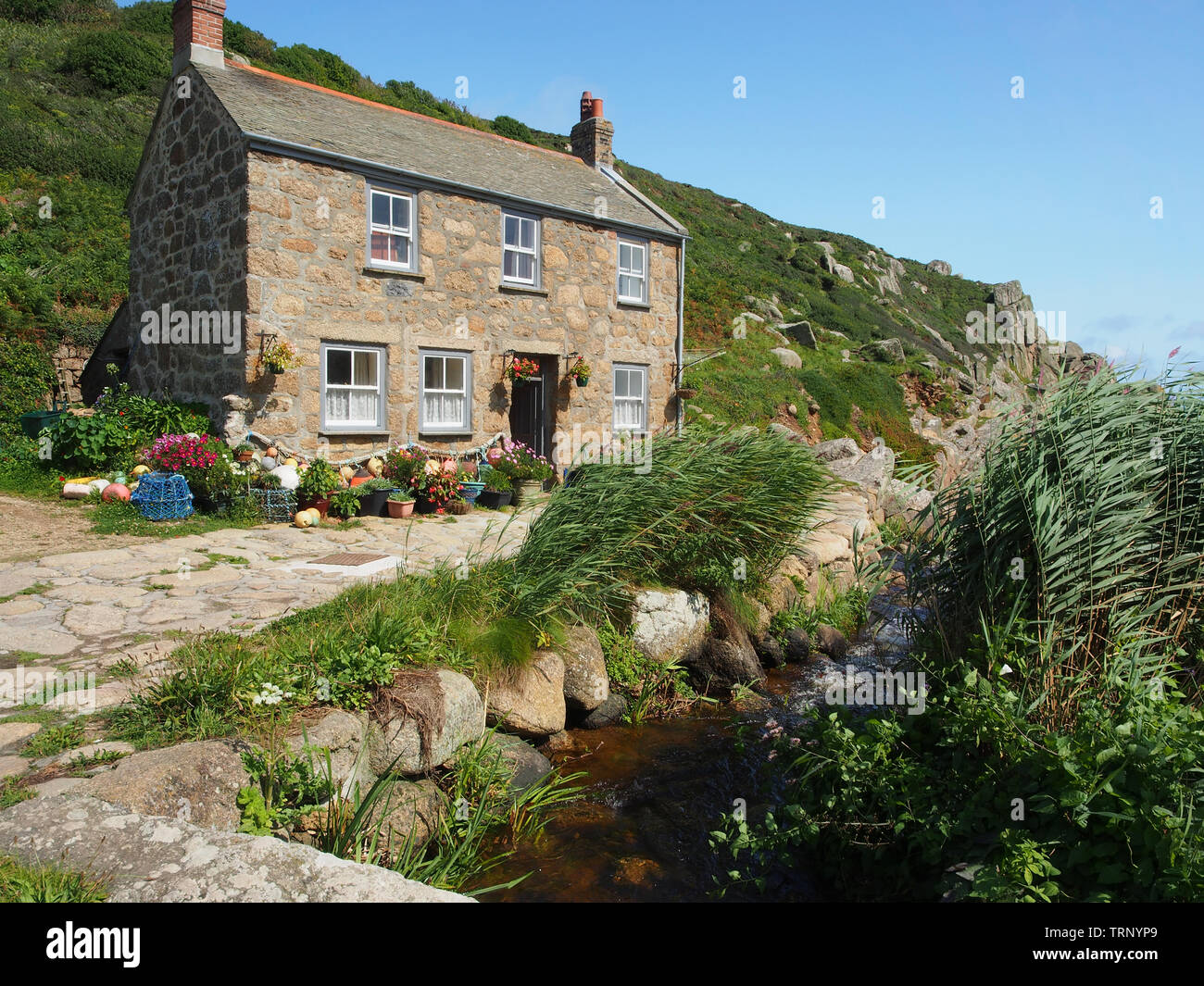 A Cottage on the quay at Penberth Cove on the Penwith Peninsula in west Cornwall, England, UK. Stock Photo