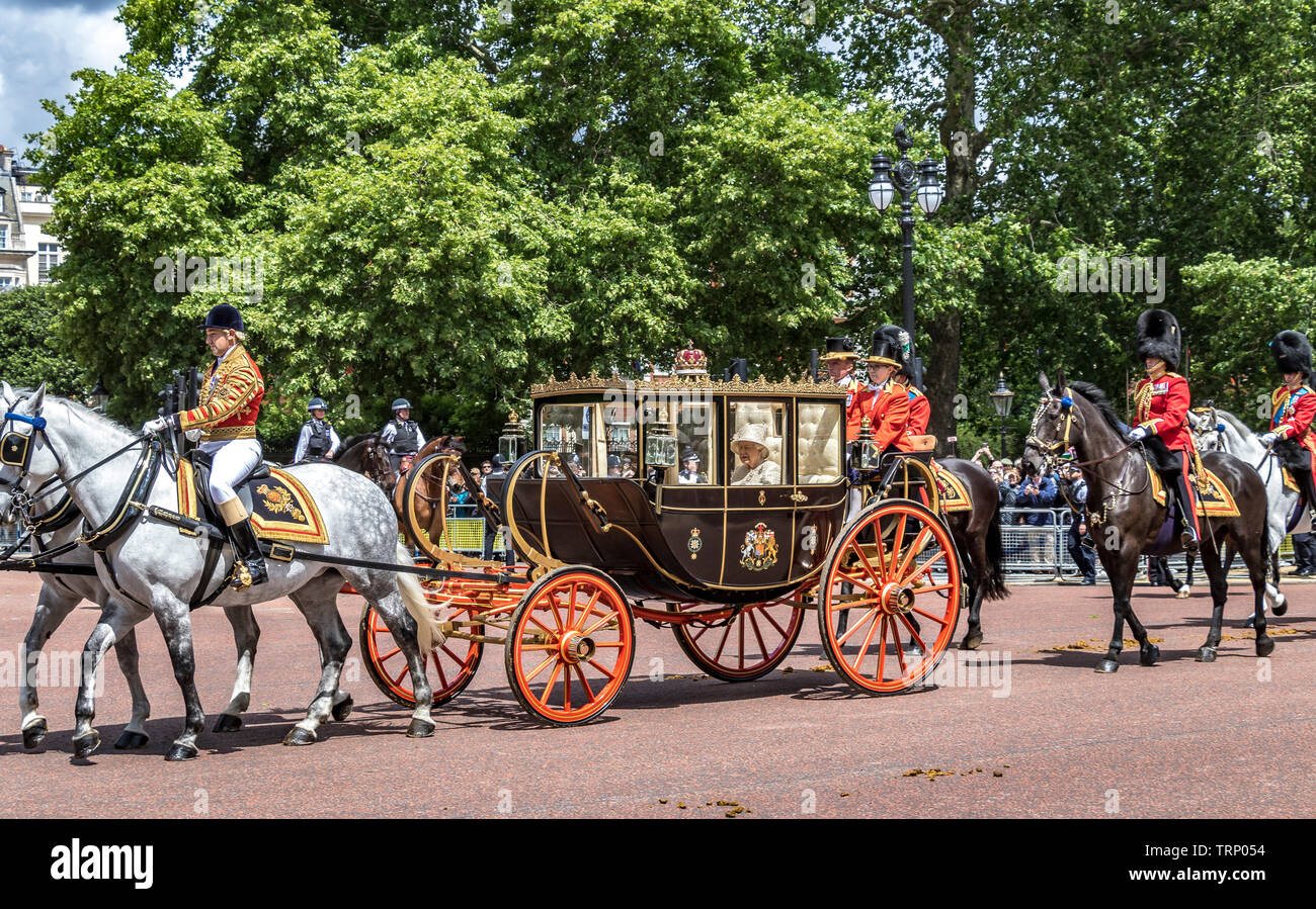 Her Majesty The Queen wearing an Angela Kelly tweed outfit riding in The Scottish State Coach along The Mall at The Trooping The Colour ceremony ,2019 Stock Photo