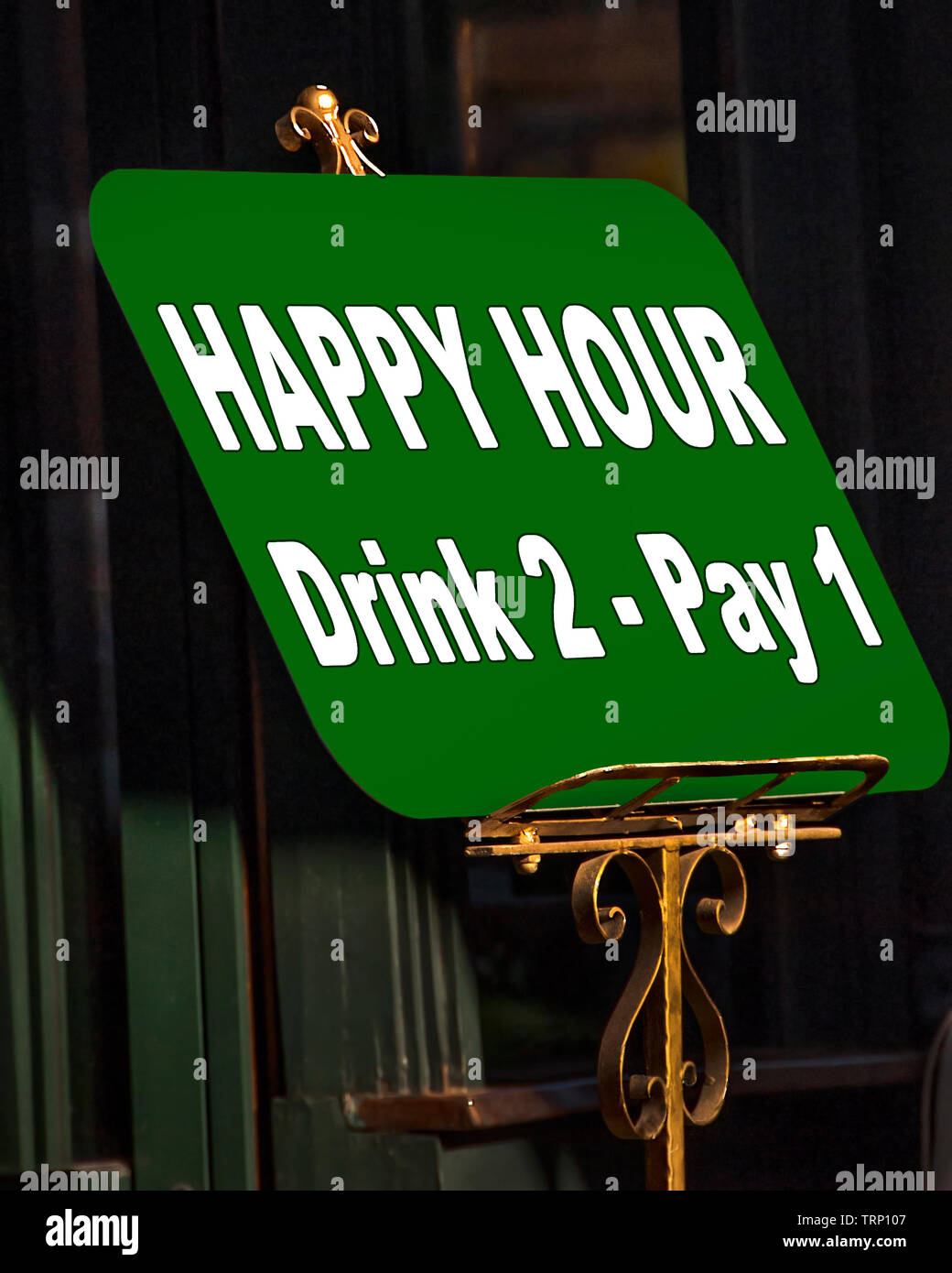 A Happy Hour sign advertises two drinks for the price of one drink. Stock Photo