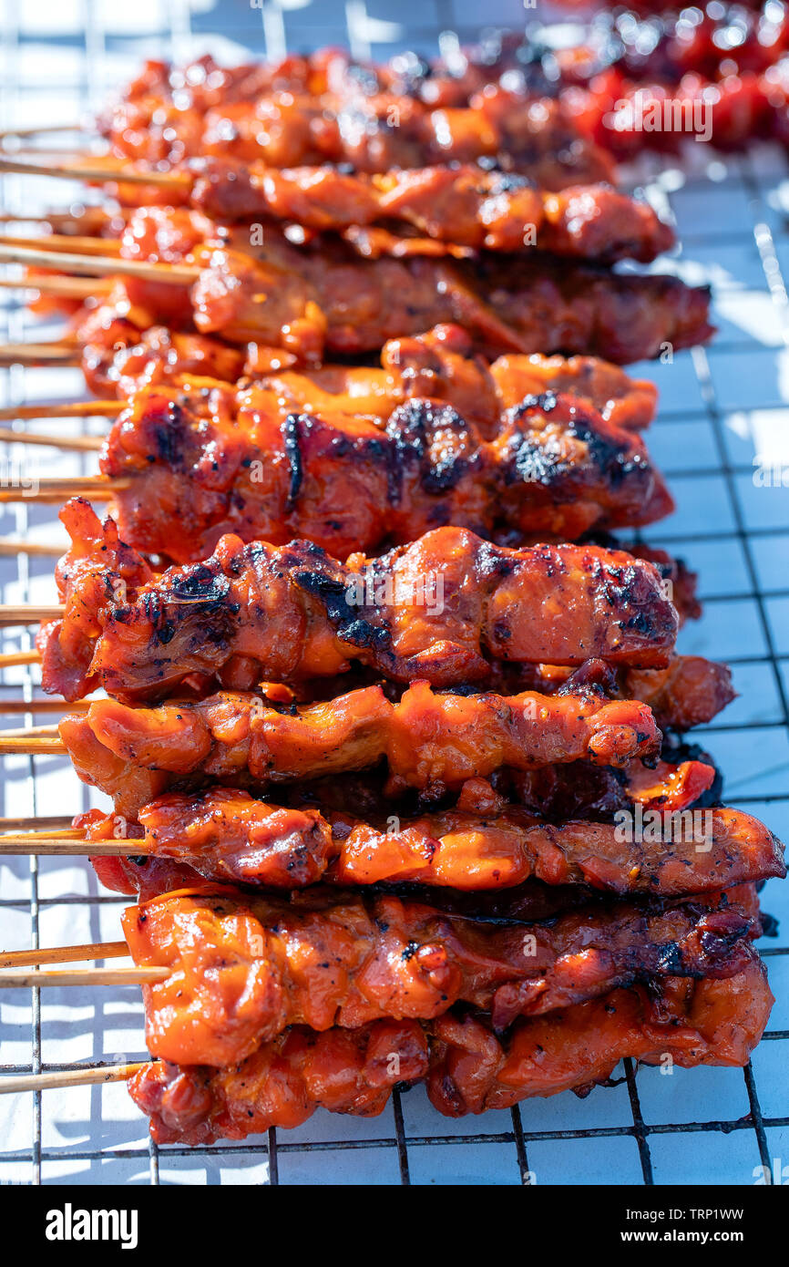Thai Street Vendor Sells Grilled Chicken Meat At Street Food