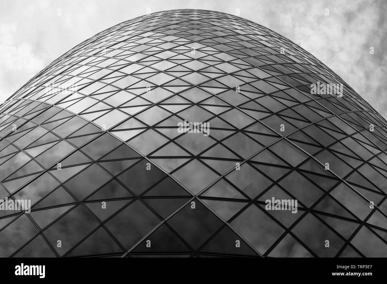View looking up at the iconic Gherkin Building, 30 St Mary Axe in the City of London financial district, designed by architect Norman Foster. Stock Photo
