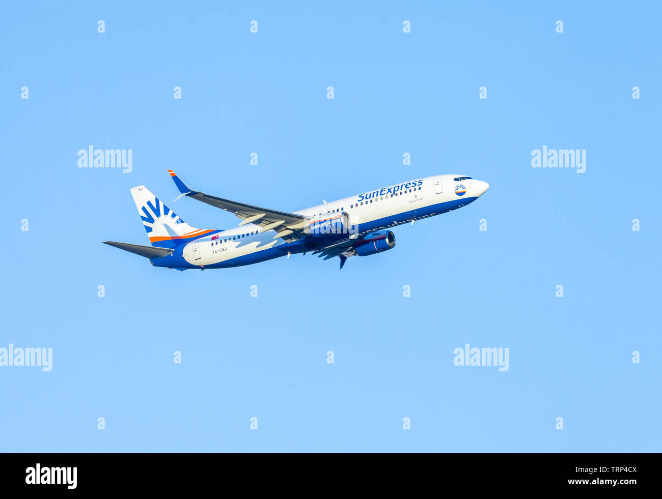 ANTALYA / TURKEY - JUNE 6, 2019: Boing 737-800 from SunExpress flies over airport Antalya, Turkey. Stock Photo