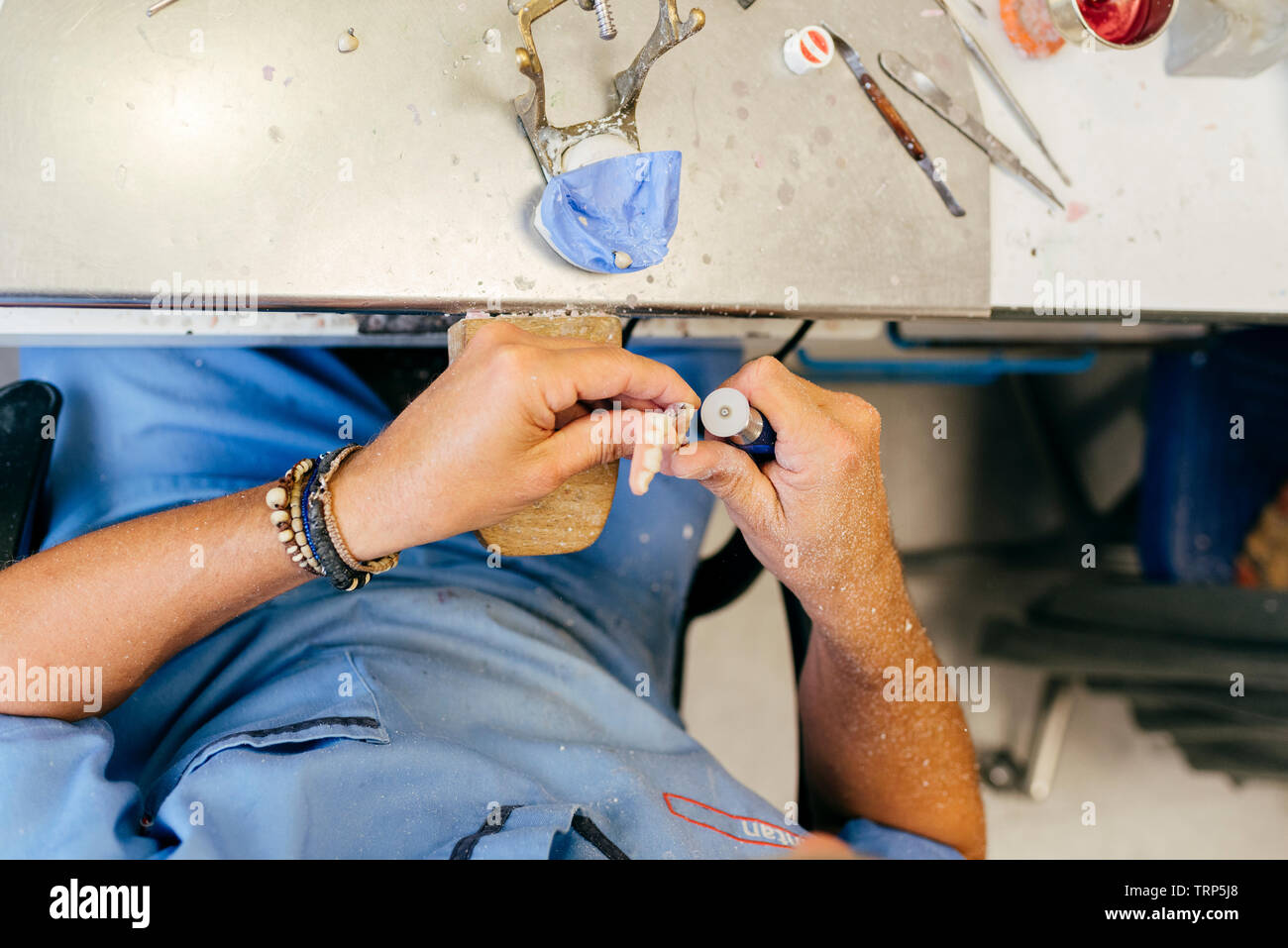 Caucasian man working on a dental prosthesis Stock Photo