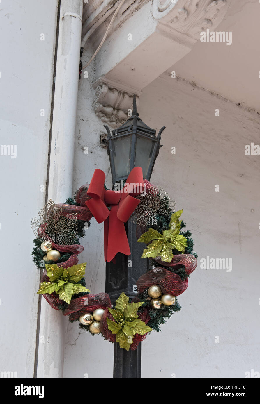 decorated with a flower wreath old street lamp in casco viejo panama city Stock Photo