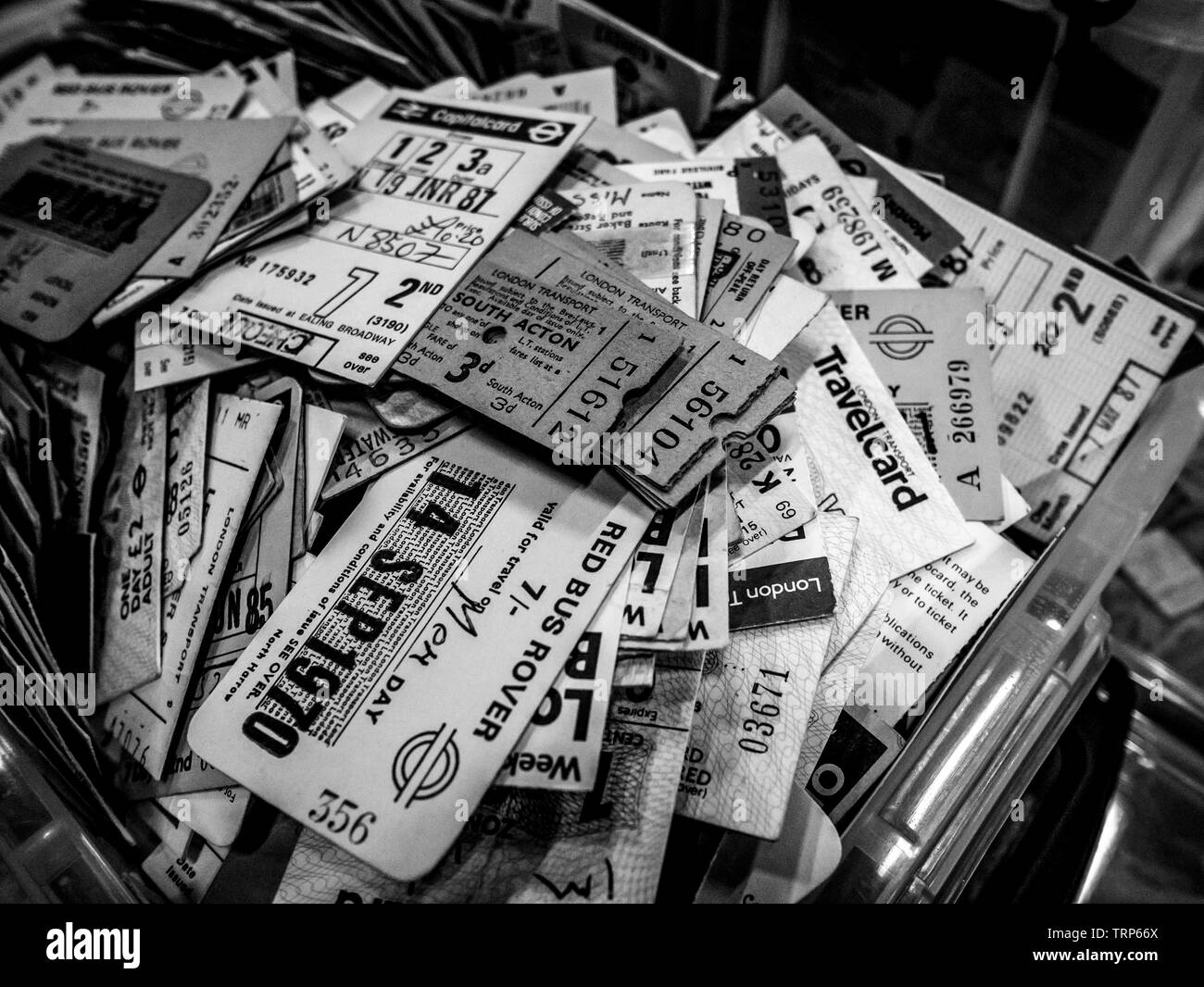 Used  Bus and Train tickets, taken at London Transport Museum Depot in Black and White Stock Photo