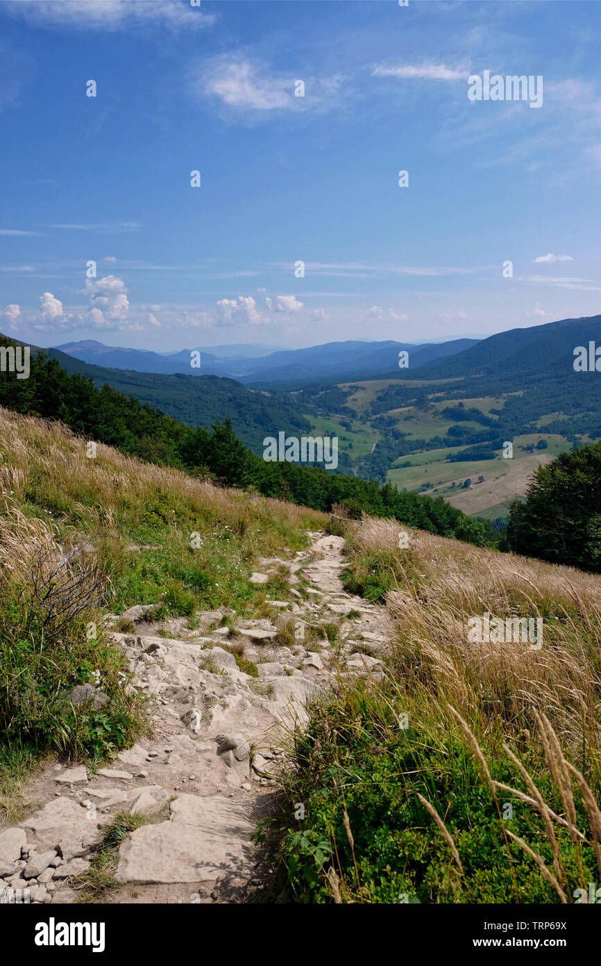 Mountain footpath view landscape from hill over blue sky background ...