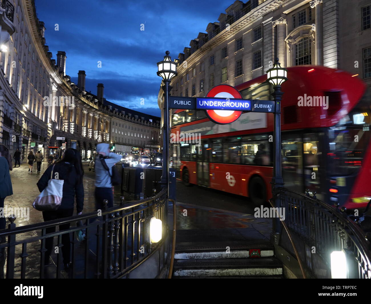 London Bus passes Piccadilly Circus station entrance on Regent Street