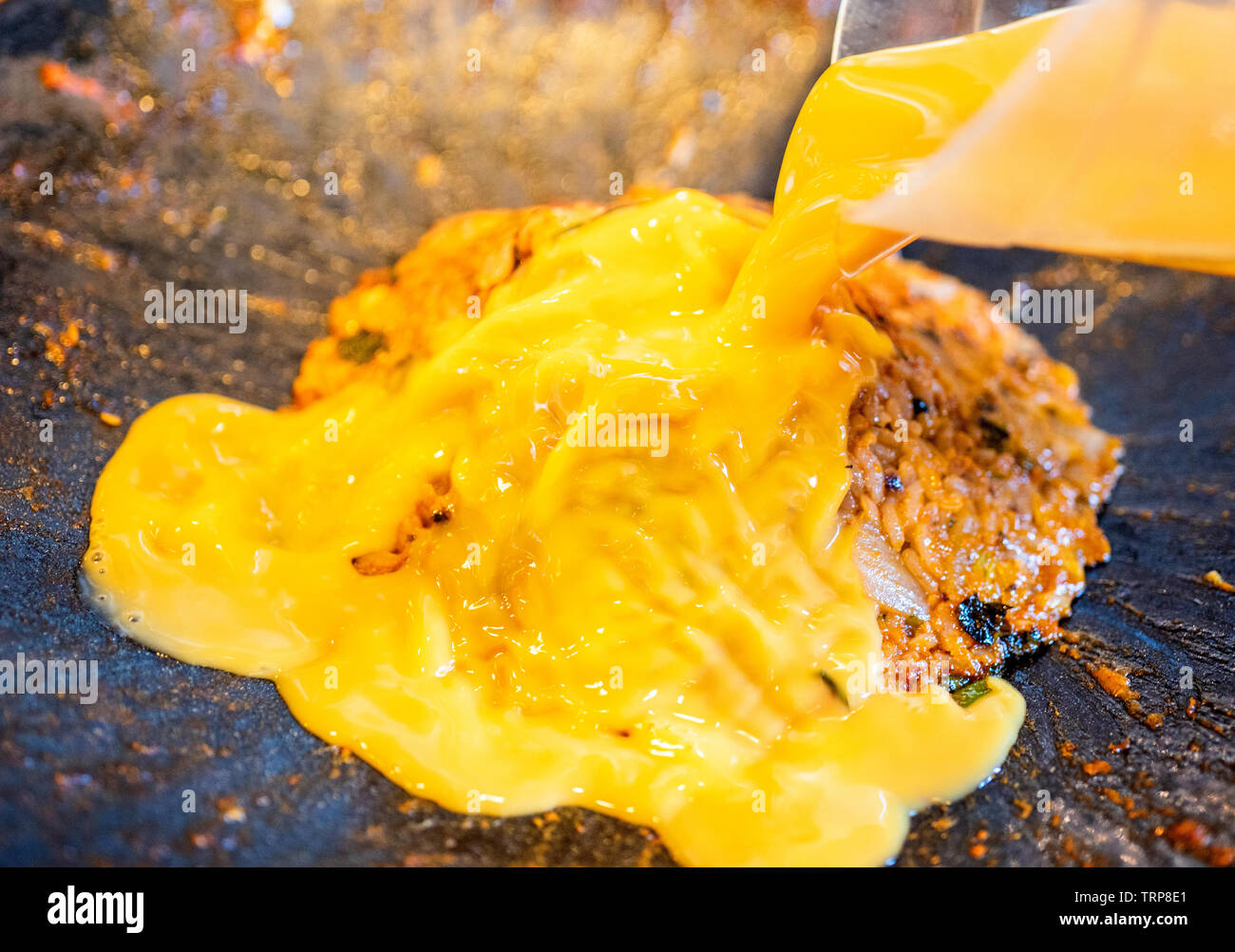 Delicious volcanic shaped fried rice with egg and spicy sauce, pork and squid, famous south korean food in jeju island restaurant, close up Stock Photo