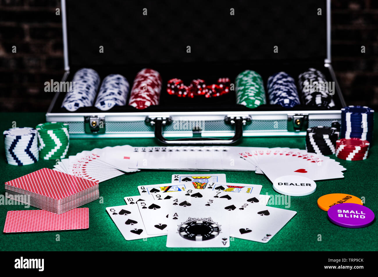 A poker table with cards, chips, dice and other accessories for setting up  a night of gaming with friends, all laid out on a green felted table ready  Stock Photo - Alamy