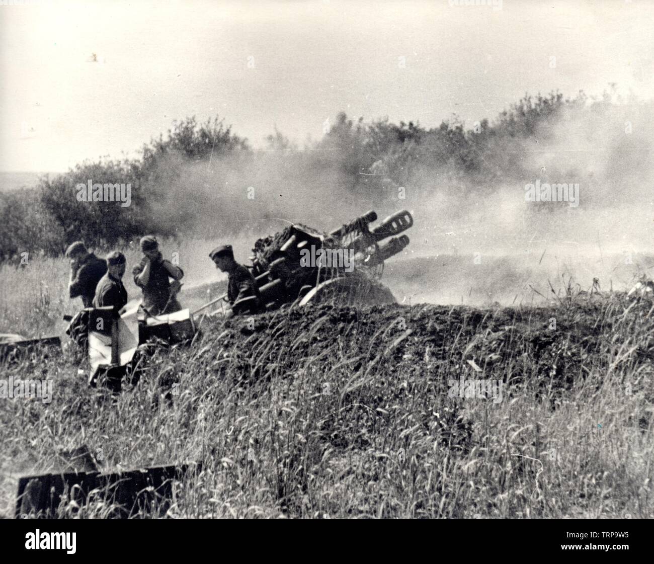 German Soldiers Fire a Light Field Howitzer in France 1944 Stock Photo