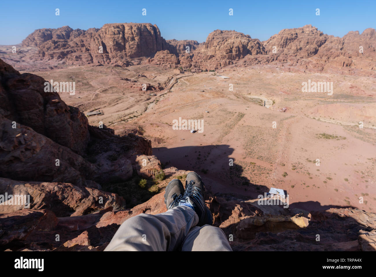 Travelling, hiking and adventurous in desert Middle-East. Traveler enjoying high angle view of desert landscape in Jordan Stock Photo