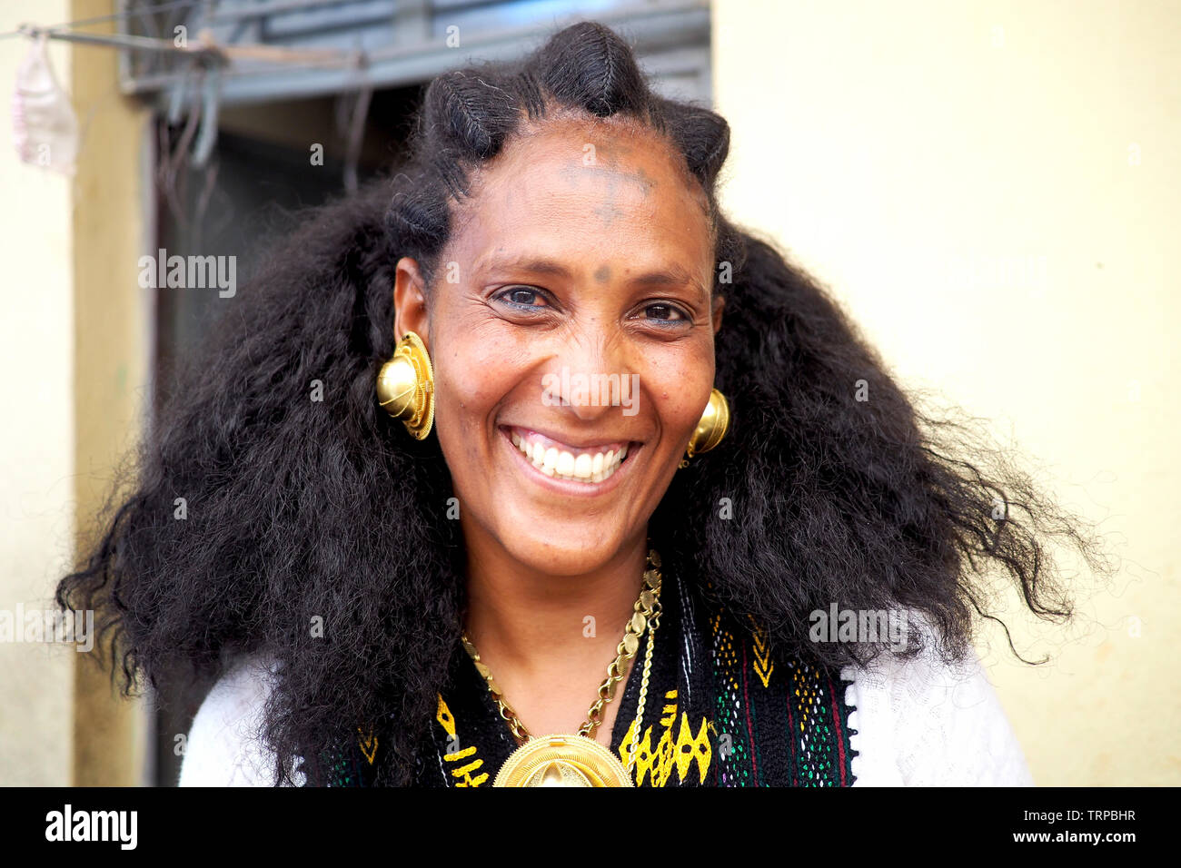 Adigrat, Ethiopia - 6 June 2019 : Ethiopian Irob woman in traditional dress, with gold earings and necklace. Stock Photo