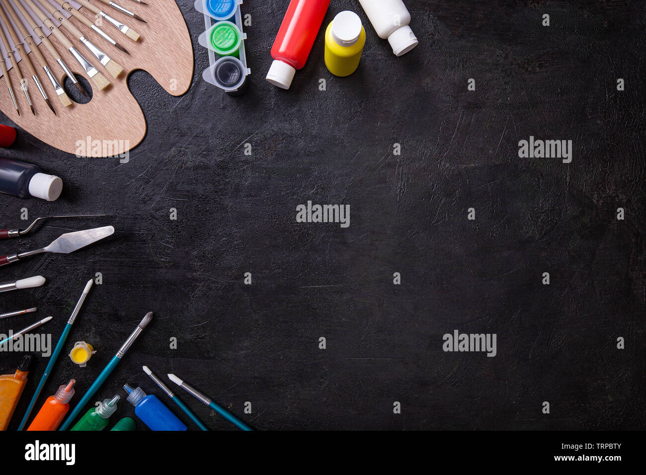 School supplies stationery equipment on chalkboard with copy space Stock Photo