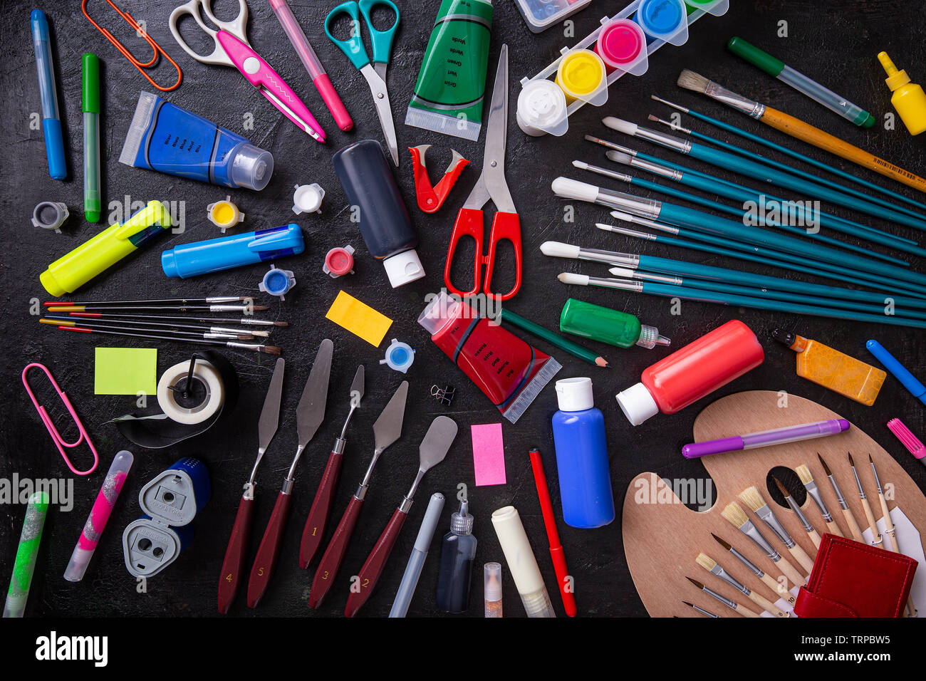 Back to School Concept with Stationery Supplies on Blackboard Stock Photo