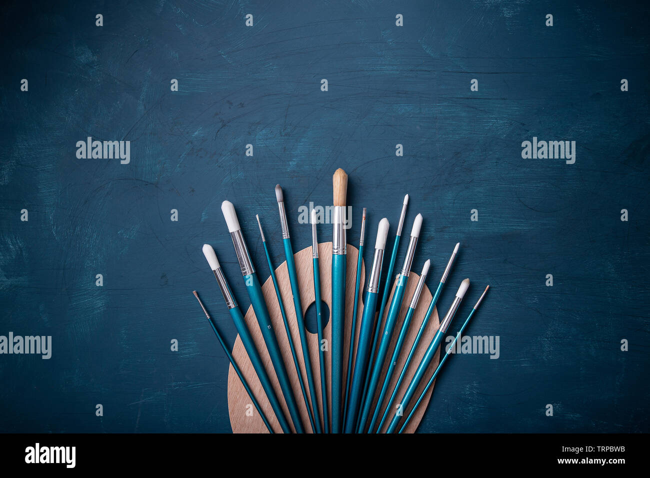 Top view of empty, new painters wooden palette with set of paint