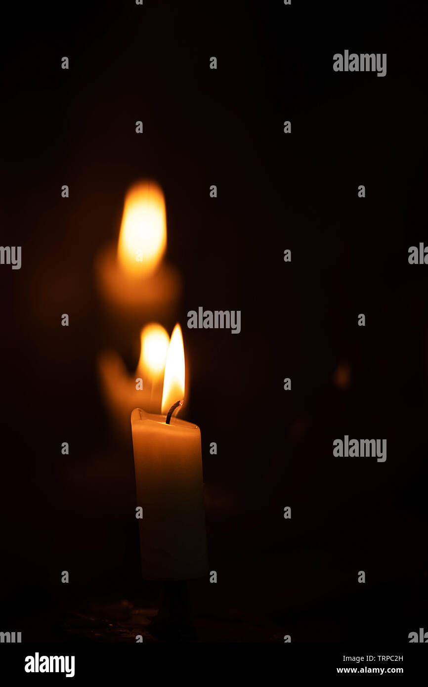 burning candles in a church dark environment Stock Photo Alamy
