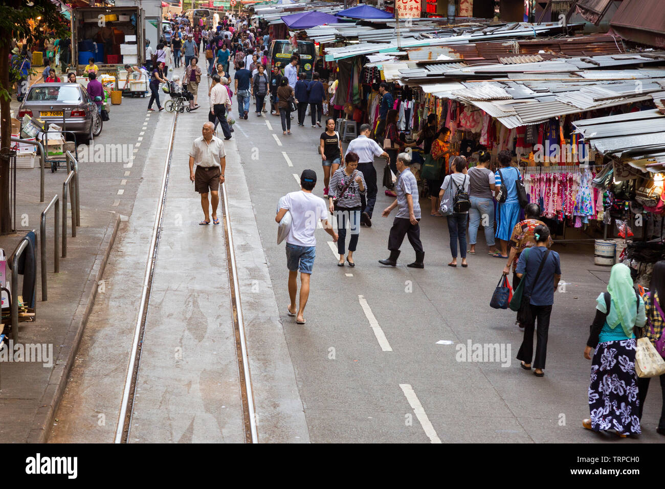 Street market and tram line, North Point, Hong Kong, SAR, China Stock Photo