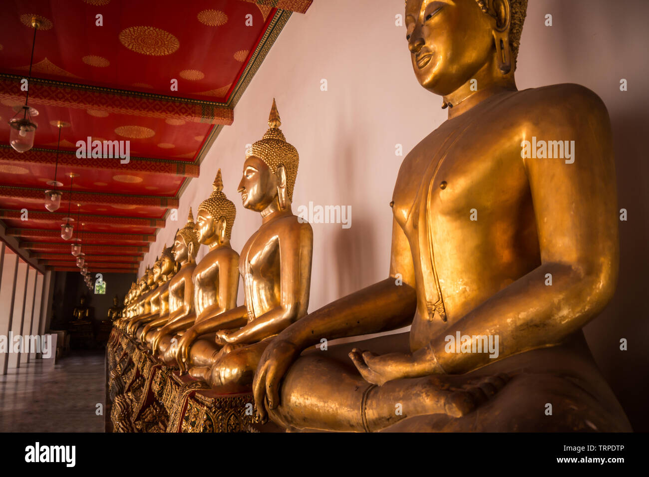 Golden Buddha statue in the temple Stock Photo - Alamy