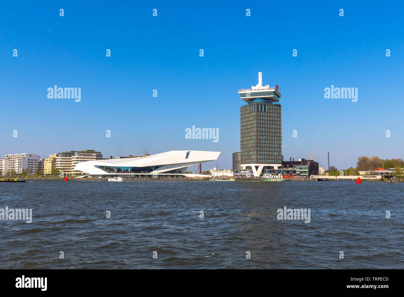Eye film Museum next to a skyscraper with a rooftop bar and an amazing swing  on the highest floor in Amsterdam Stock Photo - Alamy