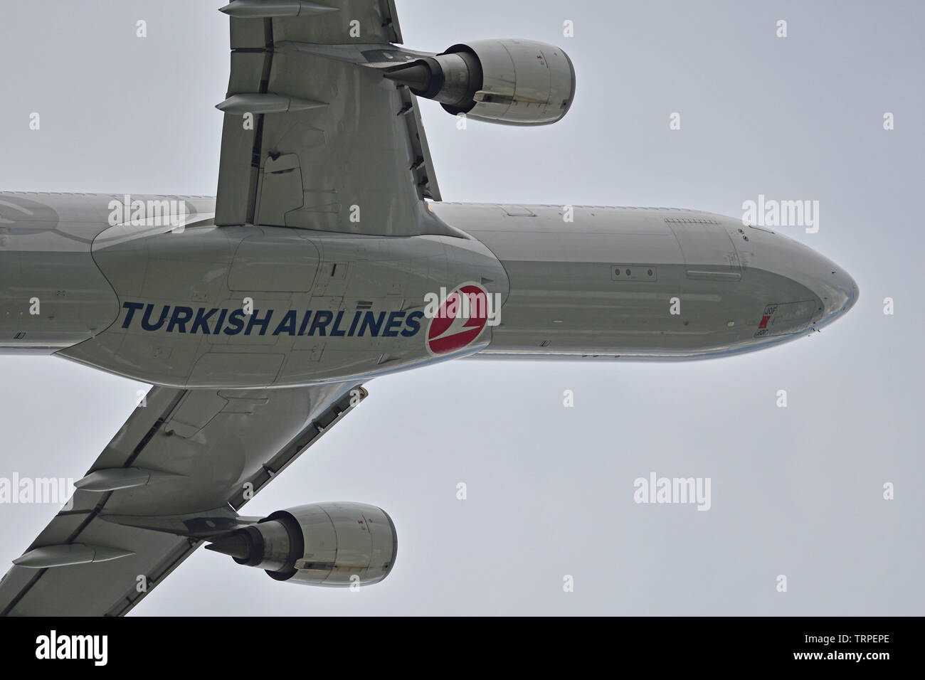 Turkish Airlines A330 airplane takes off from London's Heathrow Airport over residential homes in west London. June 8, 2019. Stock Photo