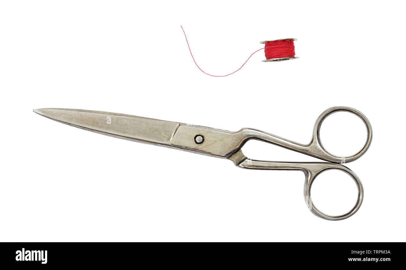 Old vintage scissors and a spool isolated on white Stock Photo