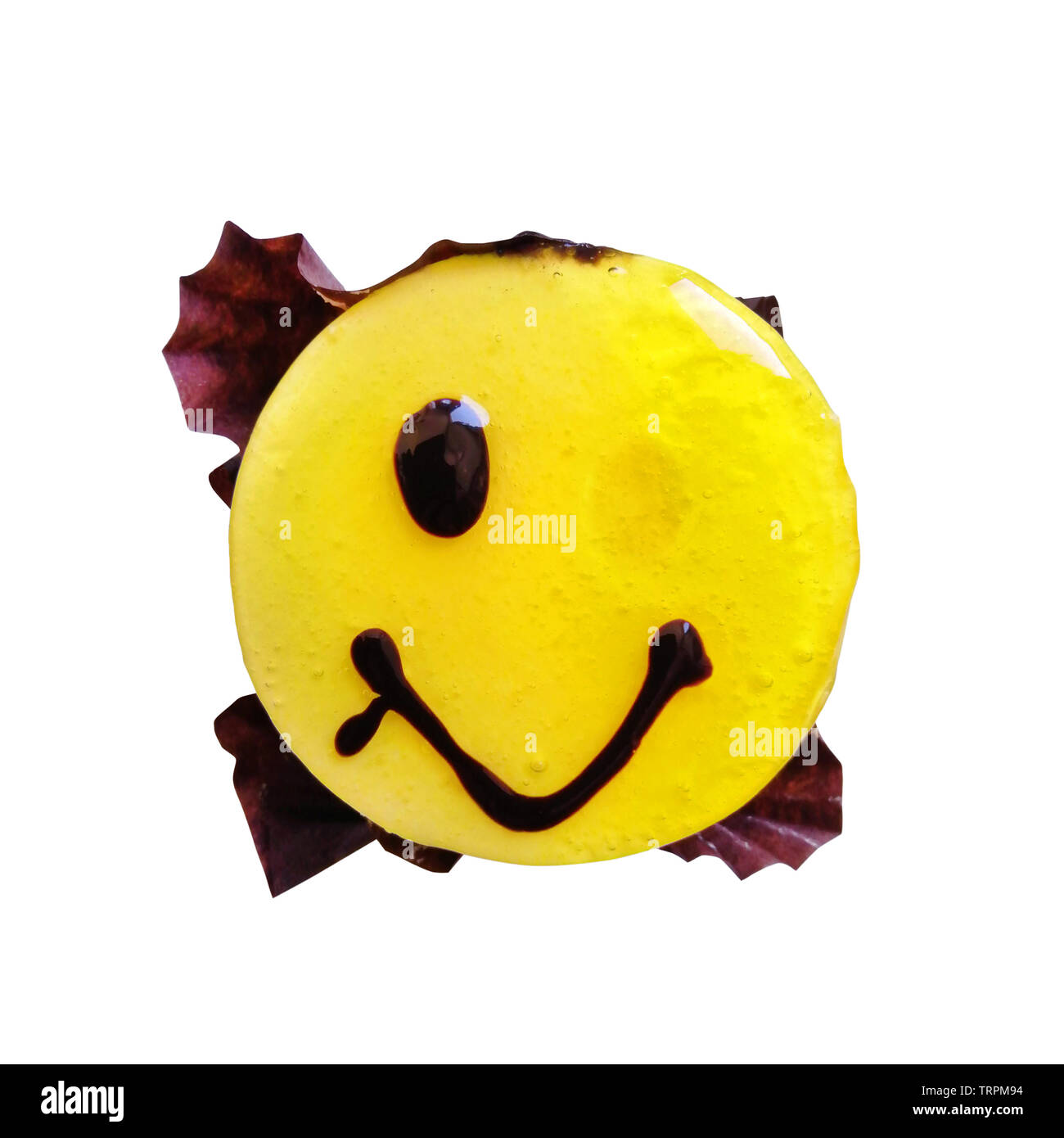 The concept of a failed diet, surprise. Funny sweet smilie, round yellow jelly cake, dessert for good mood, joy, pleasure. Stock Photo