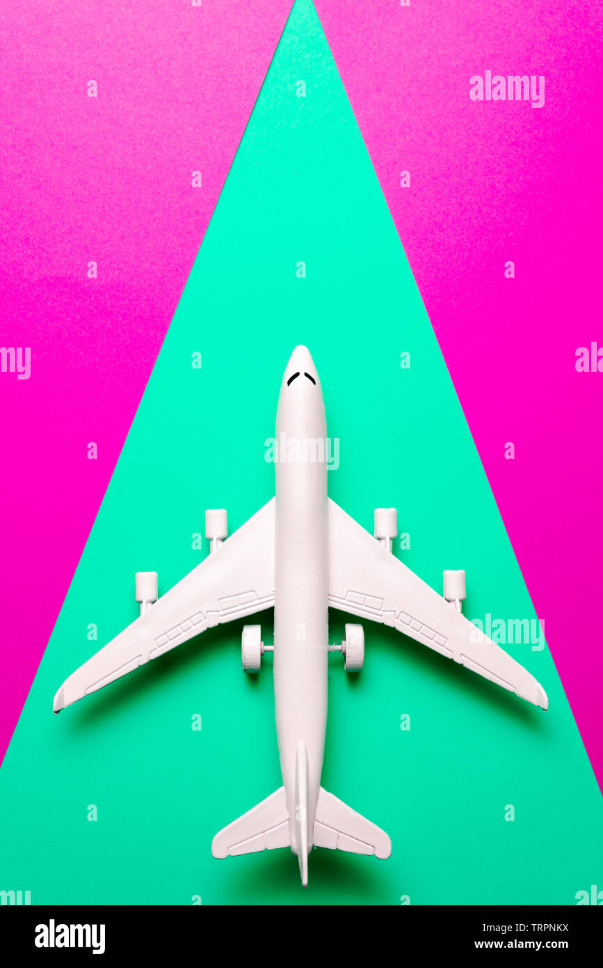 Plane Color Shape Passenger jet airplane, minimal concept, on funny colors paper with ...