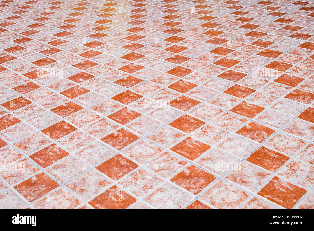 Floor table orange ceramic tiled flat background Stock Photo