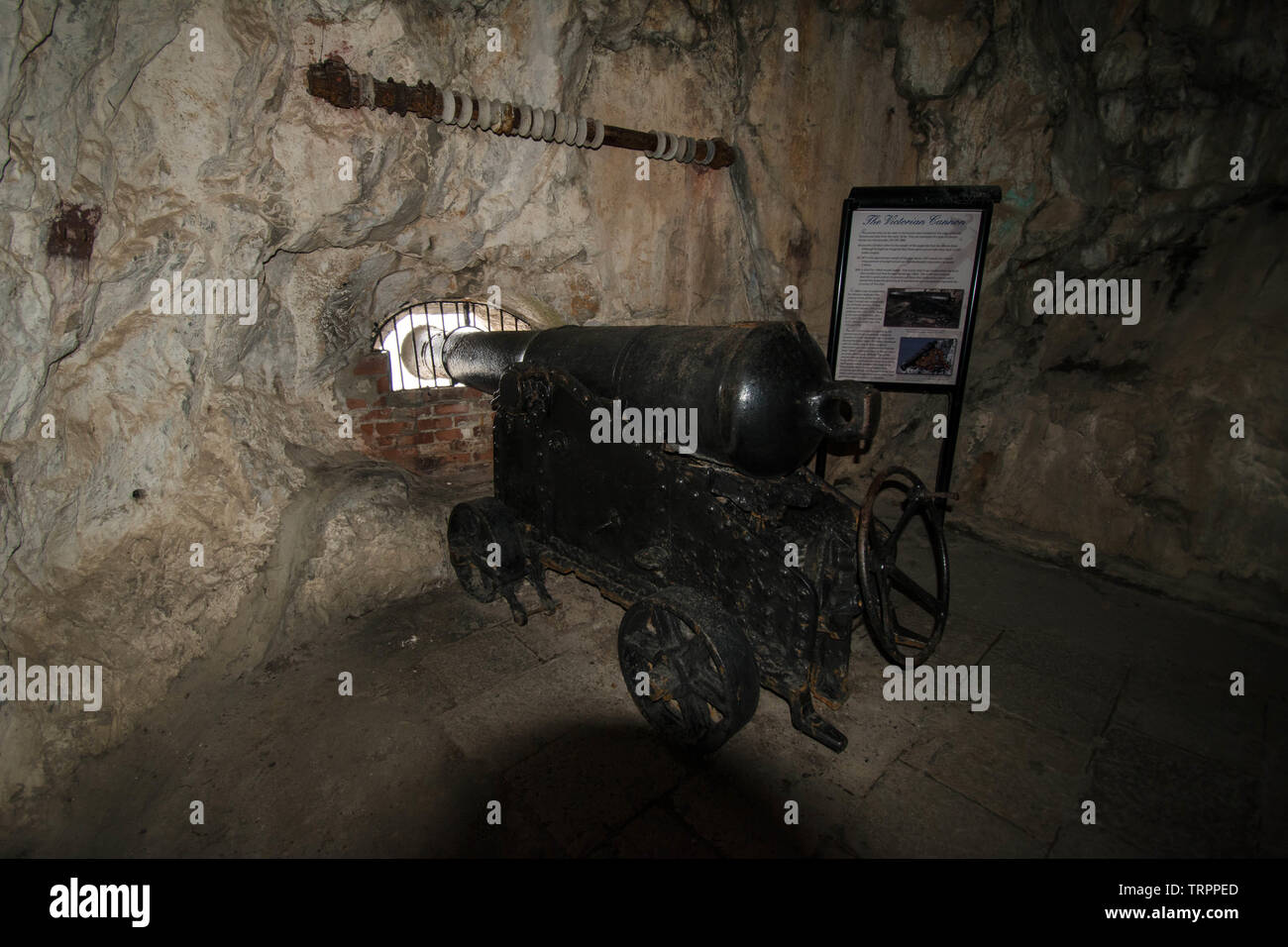 Caves in Gibraltar cannon wheel wheels sign protect protecting rock