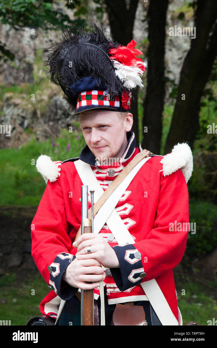 Reenactor of the Napoleonic wars in Scottish army uniform athe Rock of Ages festival at Dumbarton Castle, Scotland Stock Photo